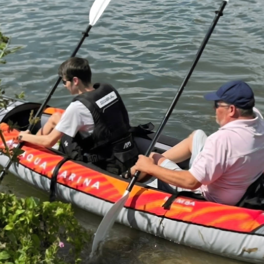 A picture of Dante and his carer in a kayak