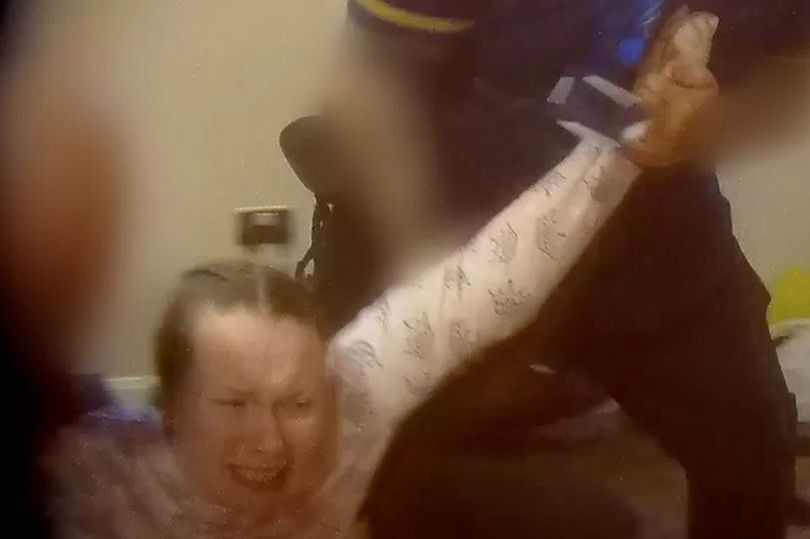 Image of a woman being manhandled taken from BBC Panorama documentary. 