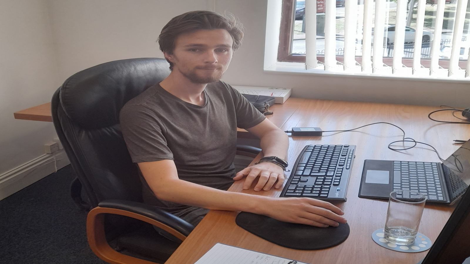 Sam, Ategi intern, sat behind a desk