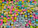  A wall of multicoloured post it notes. 
