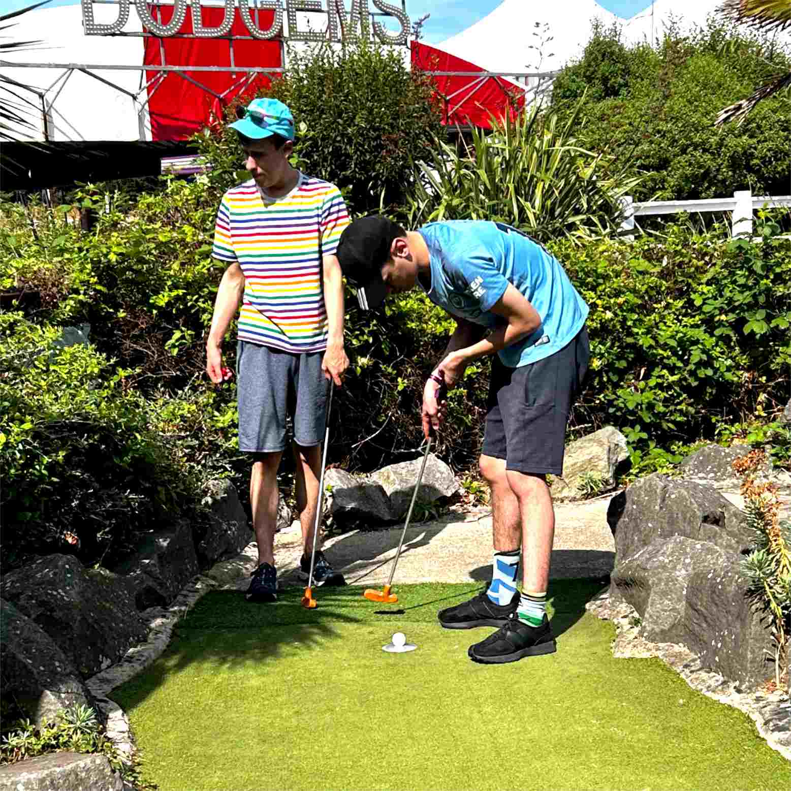 An image picturing the brothers playing Crazy Golf