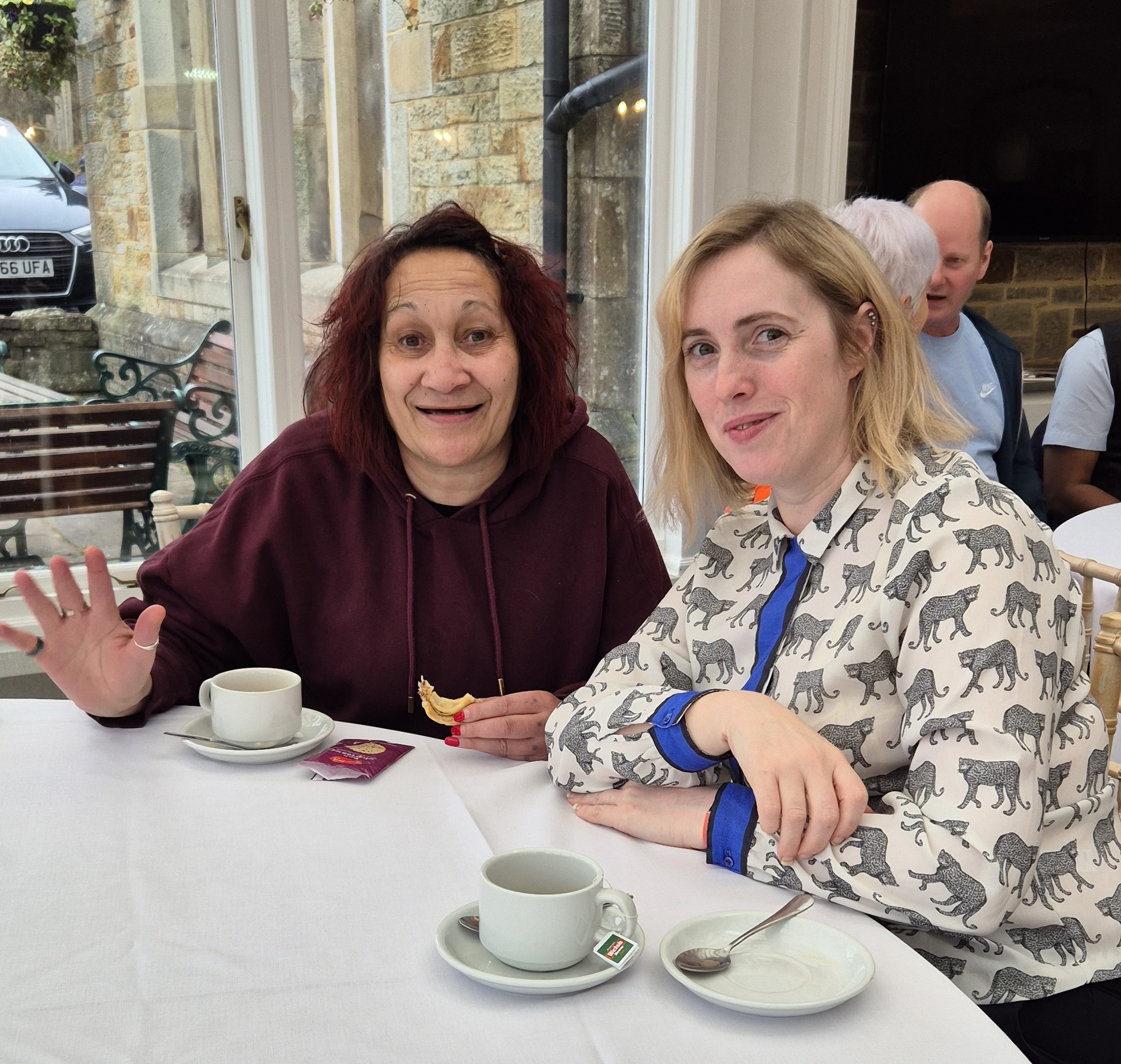 Ategi Trustee, Erika, chatting to Shirley one of the people we support.